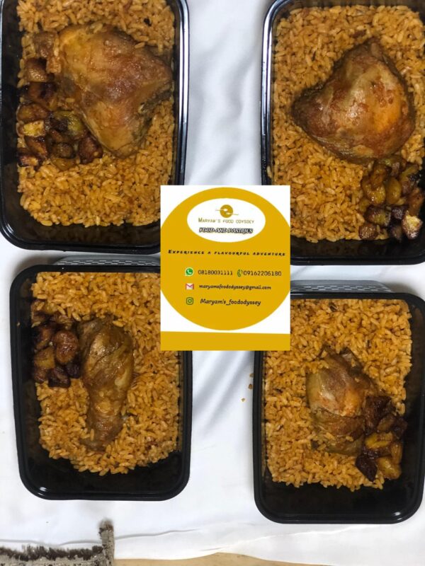 Smoky jollof rice with stewed chicken and plantain